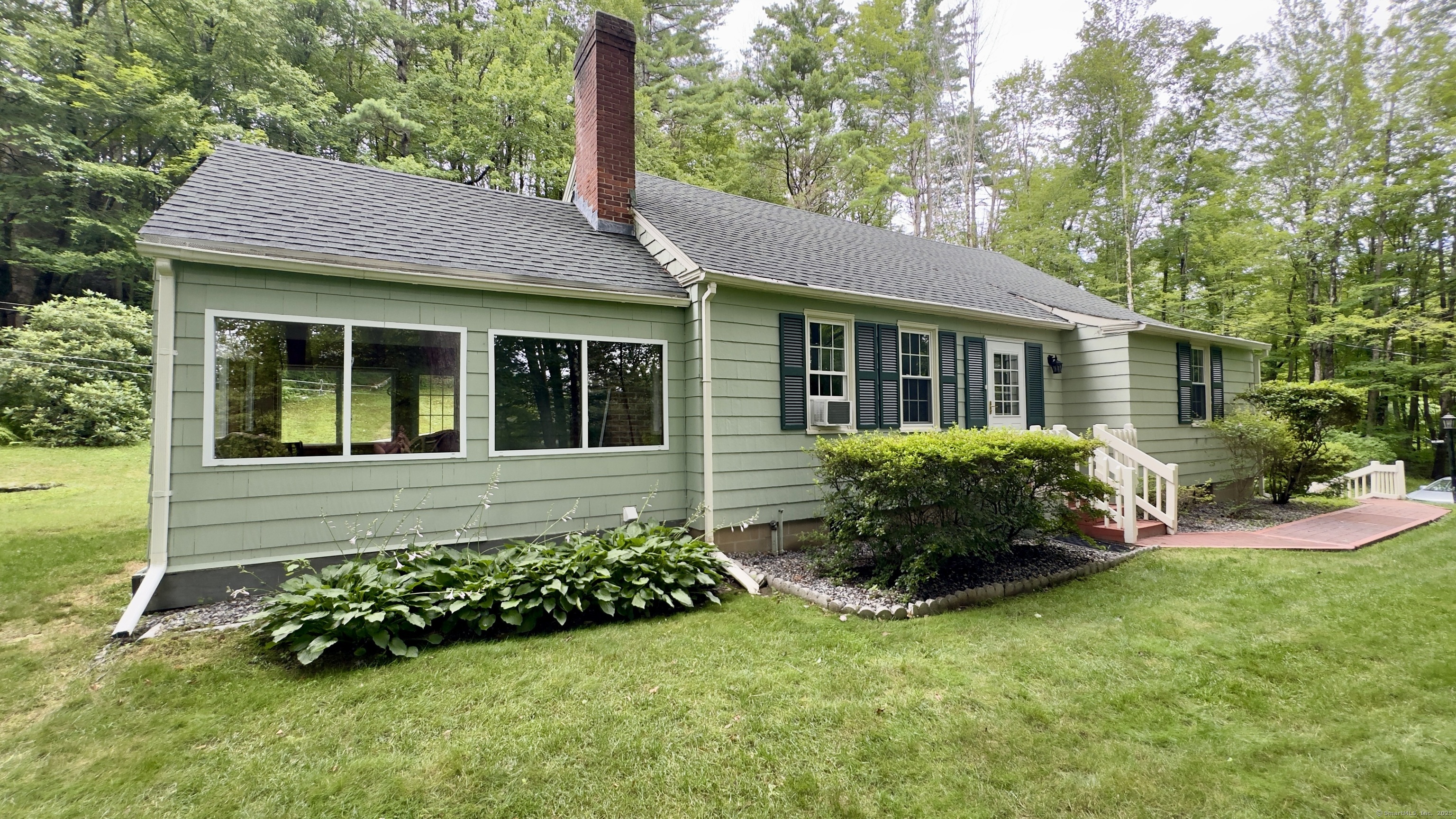 a view of a house with a garden