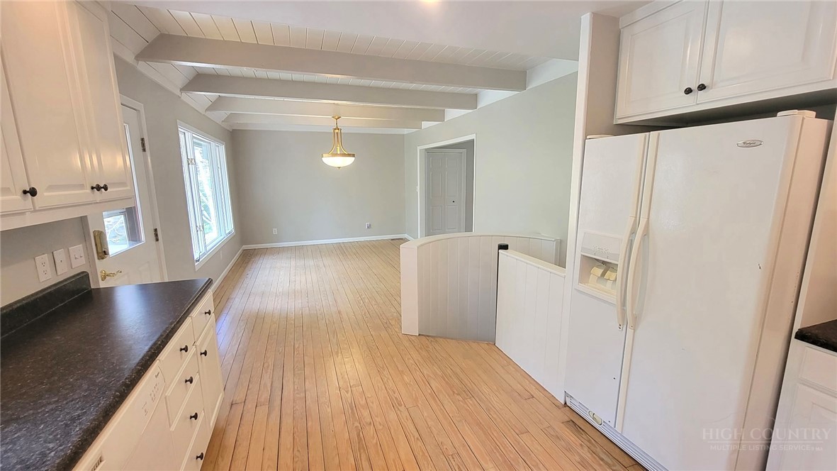 172 Yarrow Lane Boone, NC 28607 - Photo 9 of 30 a view of a kitchen with wooden floor and electronic appliances
