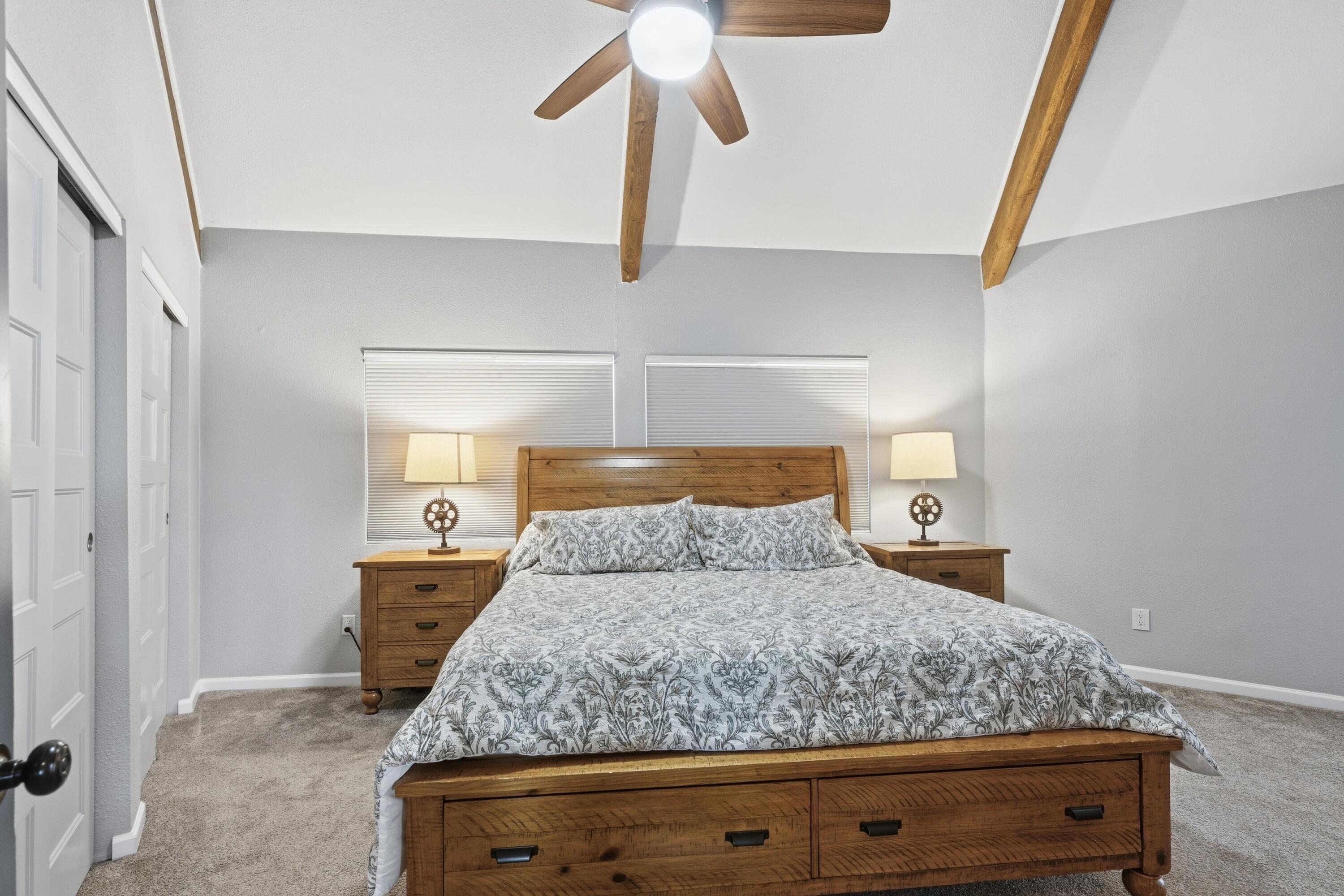 4074 Southwest Reif Road Powell Butte, OR 97753 - Photo 14 of 59 a bedroom with a bed and cabinet