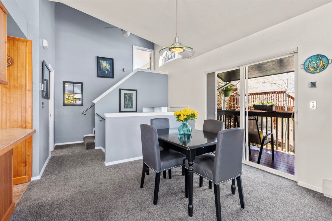 654 Alpine Road Dillon, CO 80435 - Photo 14 of 40 a view of a dining room with furniture and a chandelier
