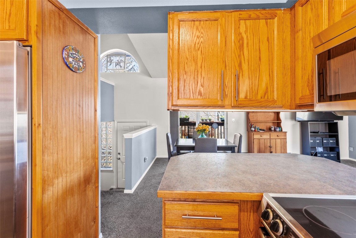 654 Alpine Road Dillon, CO 80435 - Photo 23 of 40 a kitchen with a sink and a refrigerator