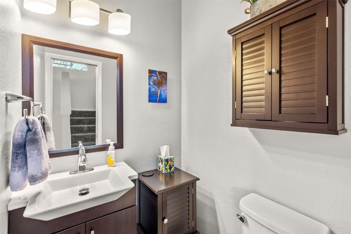 654 Alpine Road Dillon, CO 80435 - Photo 24 of 40 a bathroom with a sink a toilet and a mirror