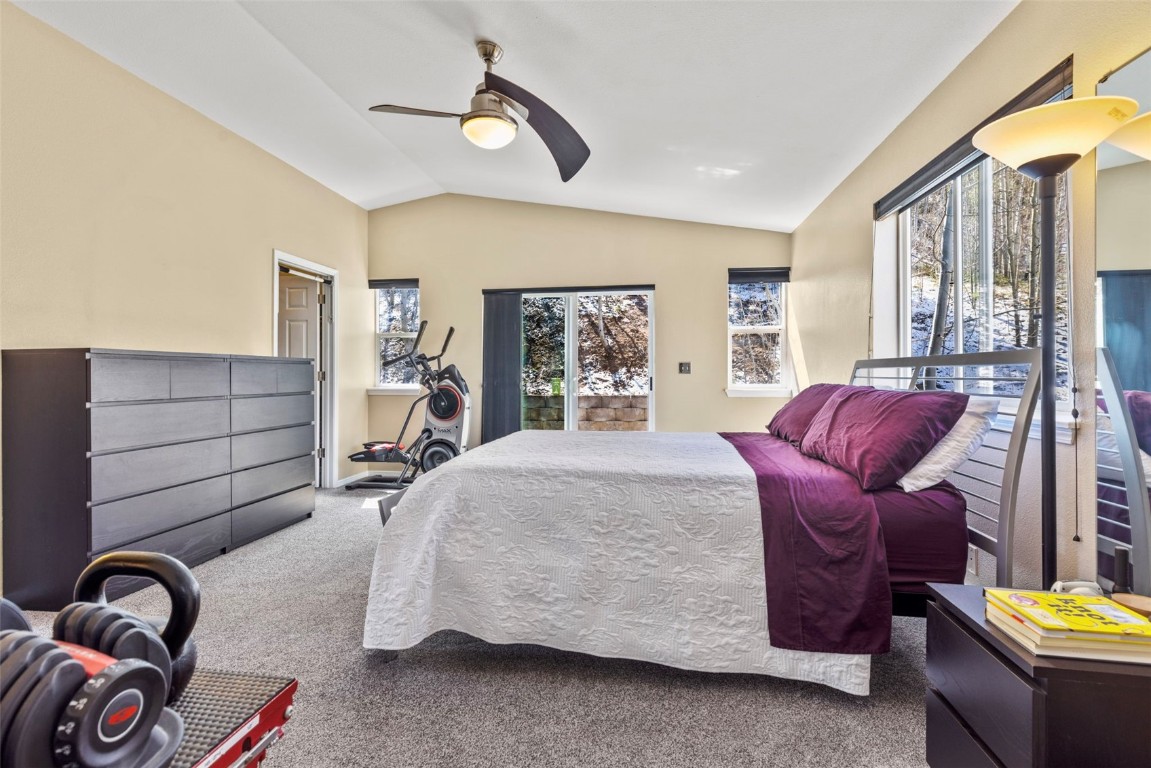 654 Alpine Road Dillon, CO 80435 - Photo 25 of 40 a bedroom with a bed and ceiling fan