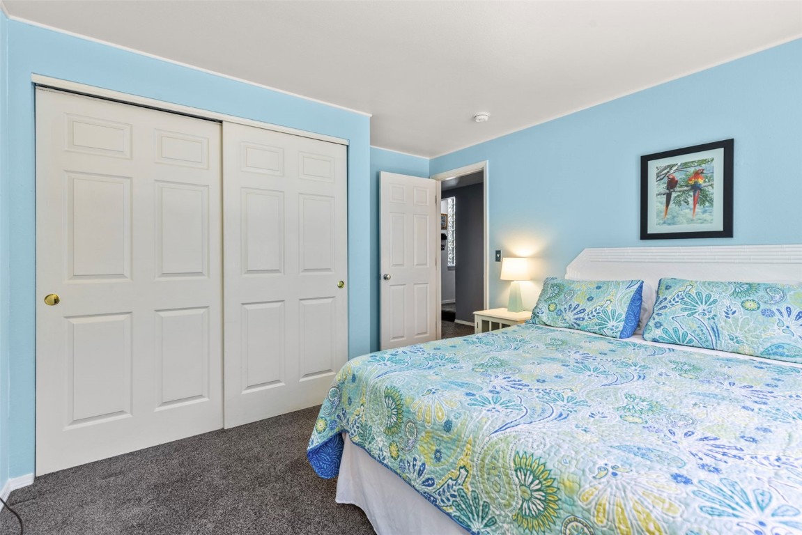 654 Alpine Road Dillon, CO 80435 - Photo 34 of 40 a bedroom with a bed and a painting on the wall