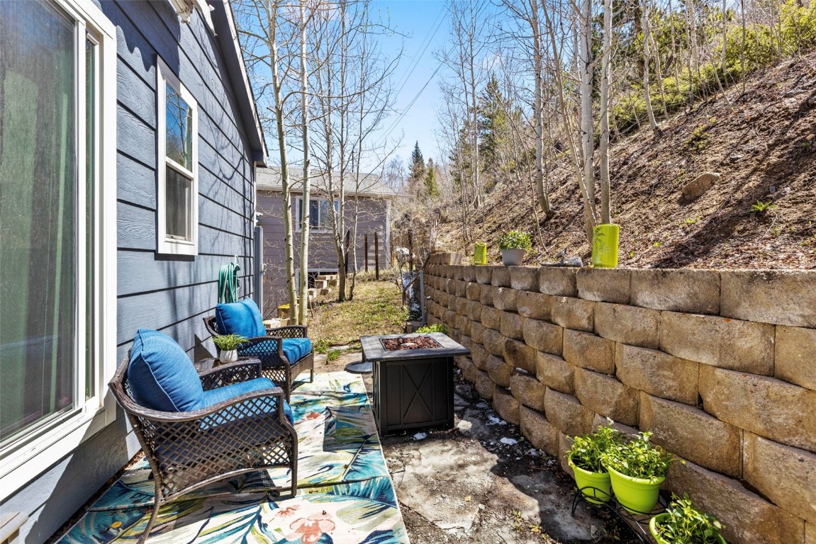 654 Alpine Road Dillon, CO 80435 - Photo 38 of 40 a view of a patio with table and chairs and potted plants