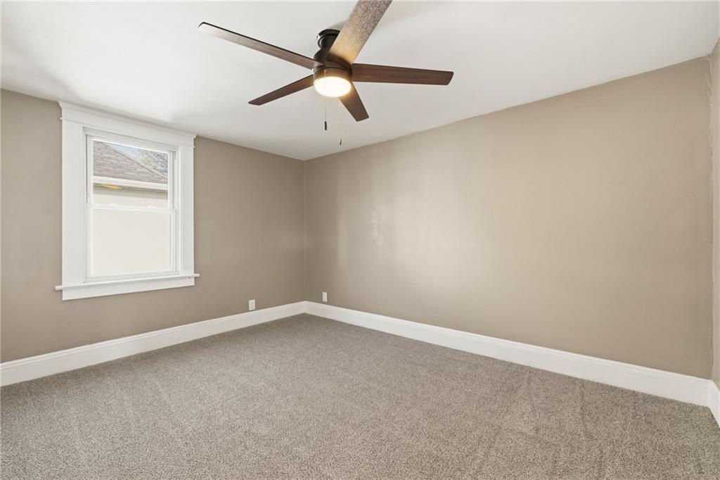 7 West Edison Avenue New Castle, PA 16101 - Photo 20 of 30 an empty room with a window and a fan