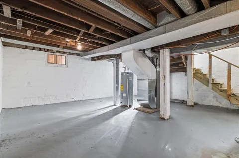 a view of a house with a yard and stairs