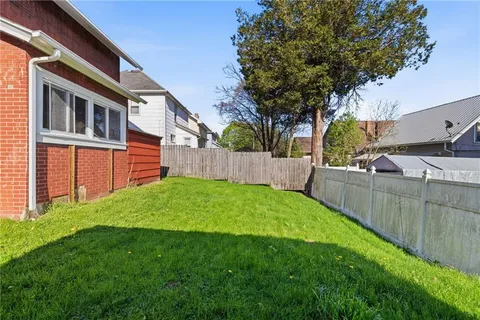 an aerial view of house with yard