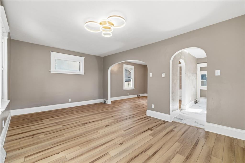 7 West Edison Avenue New Castle, PA 16101 - Photo 3 of 30 a view of a room with wooden floor and window