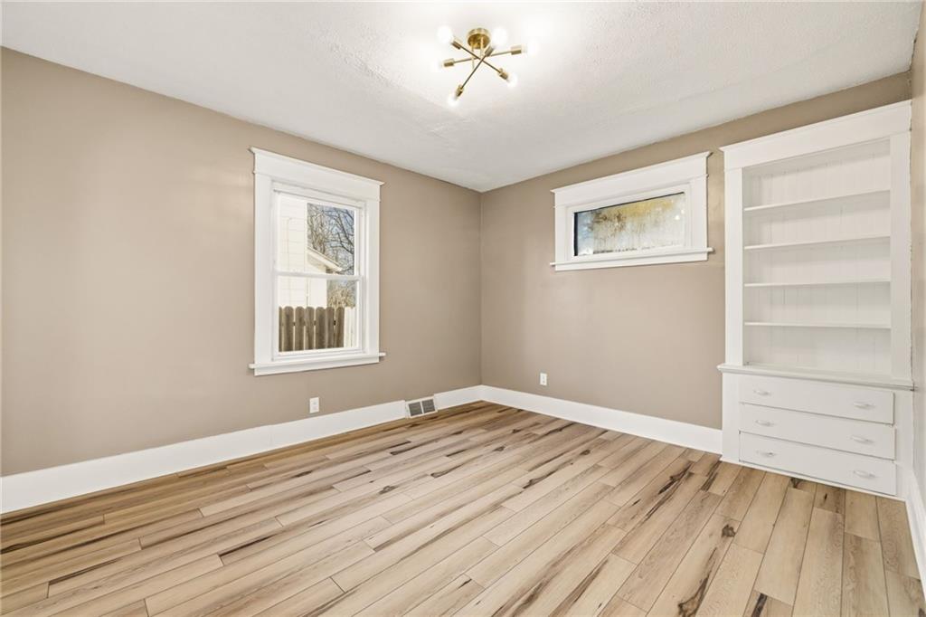 7 West Edison Avenue New Castle, PA 16101 - Photo 7 of 30 a view of empty room with wooden floor and fan