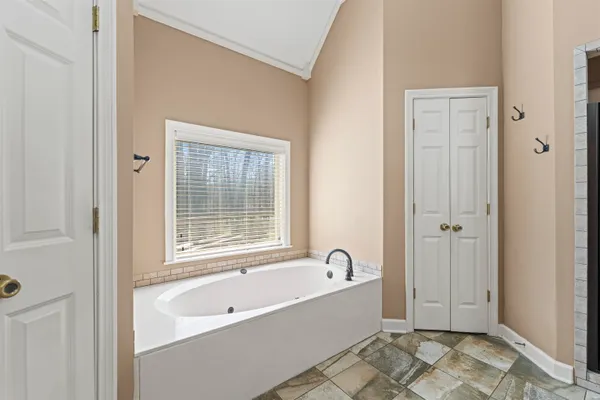 a bathroom with a bathtub and shower