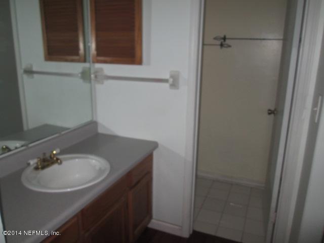 4123 Cedar Road Orange Park, FL 32065 - Photo 8 of 15 a bathroom with a sink and a mirror