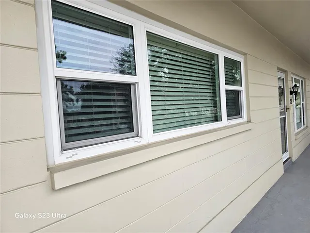 a view of a room with wooden floor and window