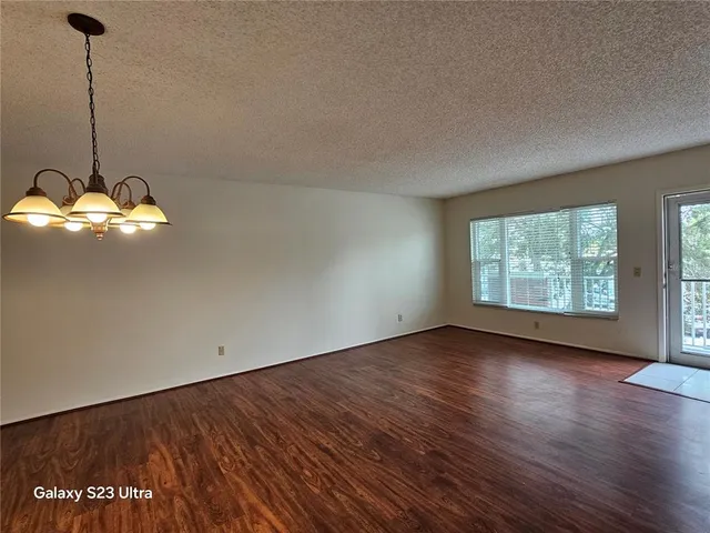 a kitchen with stainless steel appliances granite countertop a refrigerator and a stove