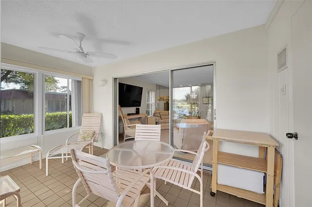 a view of a dining room with furniture wooden floor and a chandelier