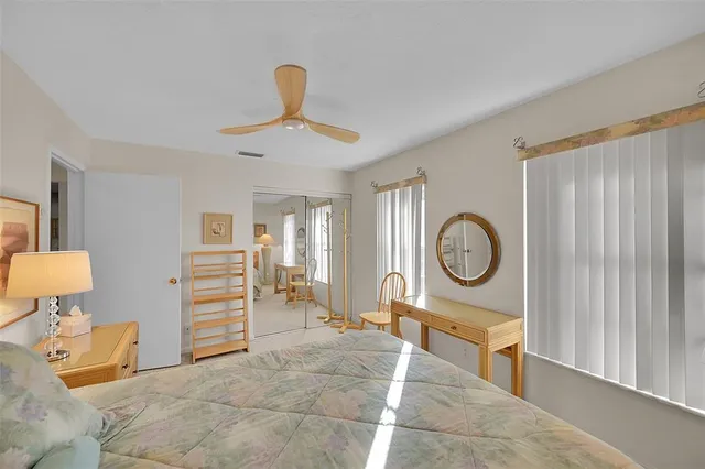 a living room with furniture a clock and a window