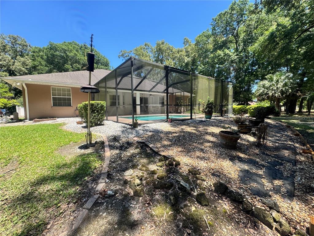 11145 Northwest 17th Court Road Ocala, FL 34475 - Photo 51 of 59 a view of a house with a yard