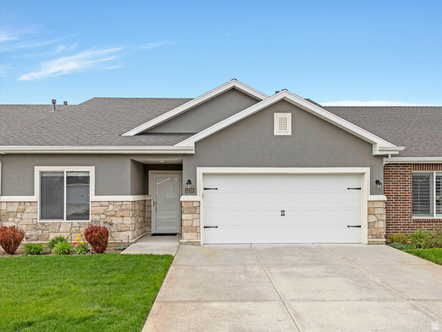 1278 South Grace Way Layton, UT 84041 - Photo 16 of 23 Stone veneer and stucco exterior featuring a two-car garage with decorative hardware