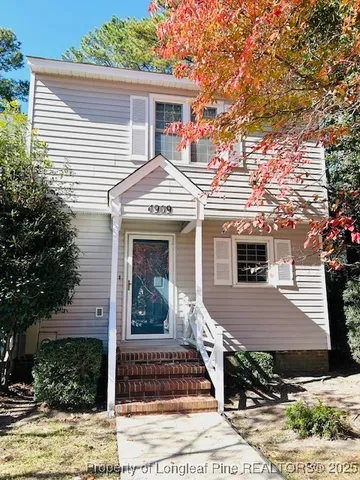 front view of a house with a deck