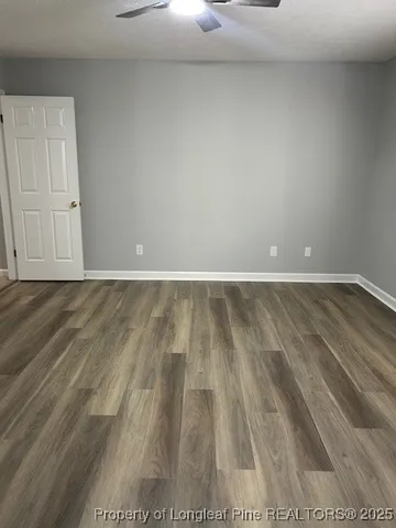 a view of room with wooden floor