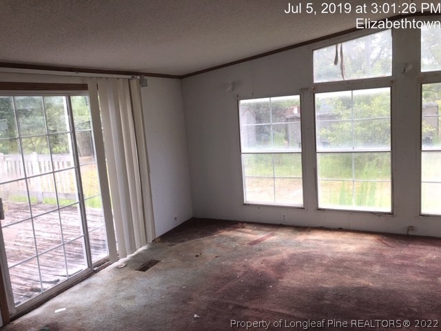 1572 Twisted Hickory Road Elizabethtown, NC 28337 - Photo 7 of 12 a view of an empty room with a window