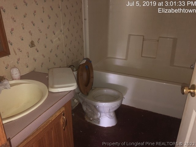 1572 Twisted Hickory Road Elizabethtown, NC 28337 - Photo 8 of 12 a bathroom with a sink and a toilet