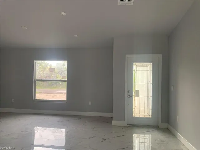 an empty room with windows