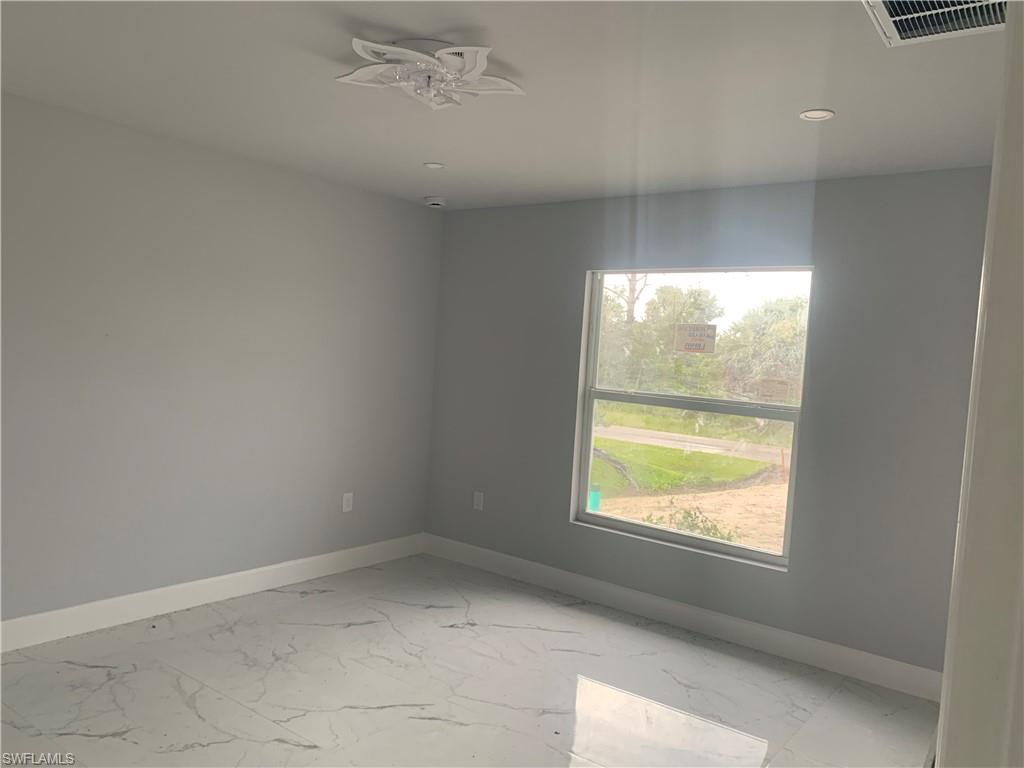 3211 43rd Street Southwest Lehigh Acres, FL 33976 - Photo 4 of 18 a view of empty room with window