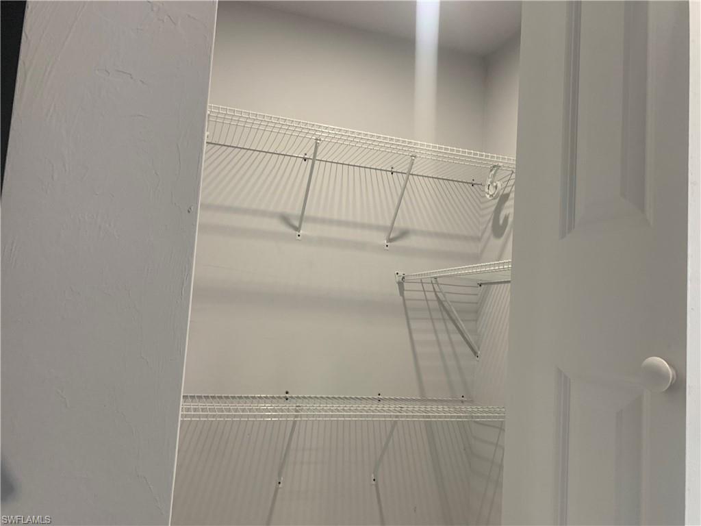 3211 43rd Street Southwest Lehigh Acres, FL 33976 - Photo 8 of 18 a view of walk in closet