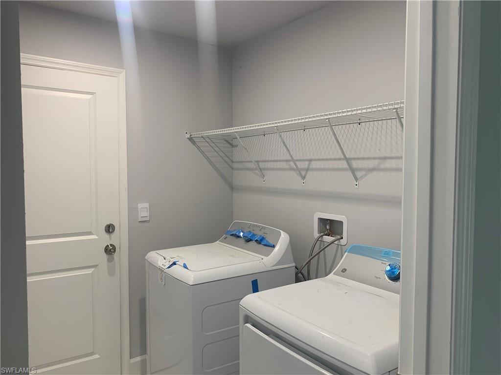 3211 43rd Street Southwest Lehigh Acres, FL 33976 - Photo 10 of 18 a utility room with dryer and washer