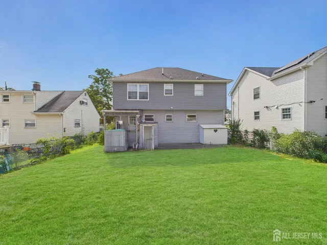a front view of house with a yard and garage