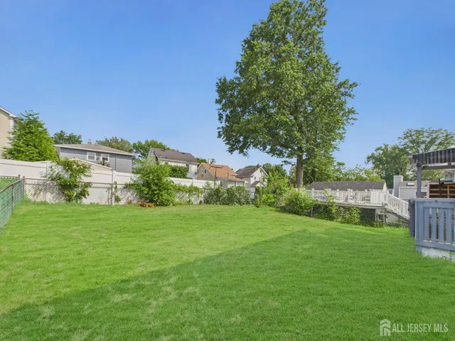 a view of a garden with a building in the background