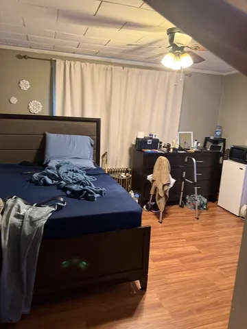 a bed sitting in a room next to a window