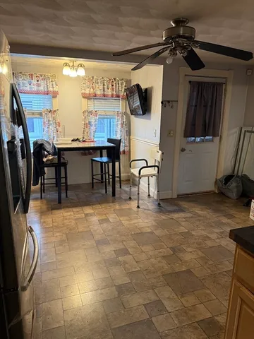 a view of a room with furniture and a window