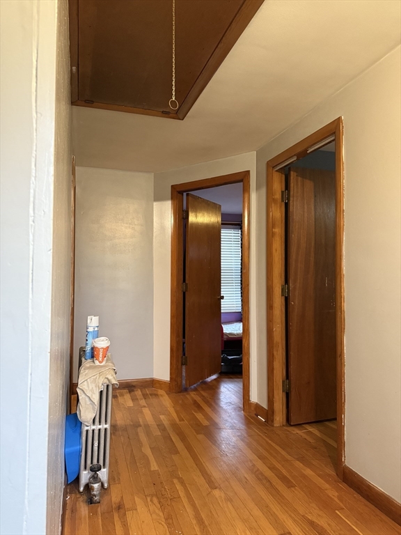 102 Weare Street Lawrence, MA 01843 - Photo 17 of 27 a view of empty room with wooden floor