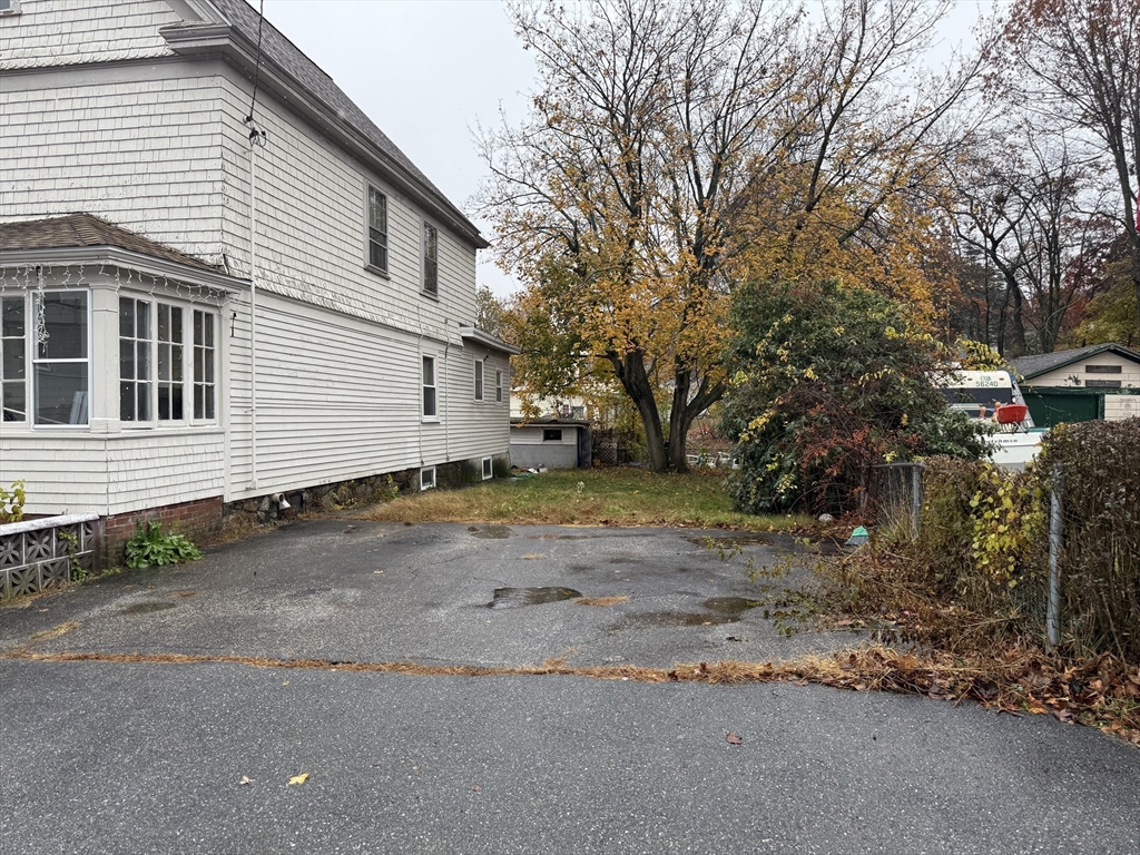 102 Weare Street Lawrence, MA 01843 - Photo 2 of 27 a view of a house with a yard