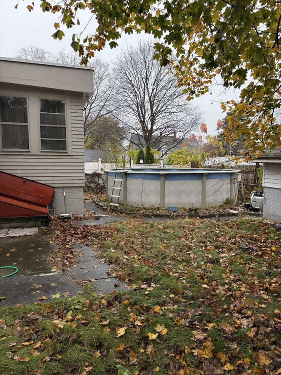 102 Weare Street Lawrence, MA 01843 - Photo 3 of 27 a view of a yard with plants and large tree