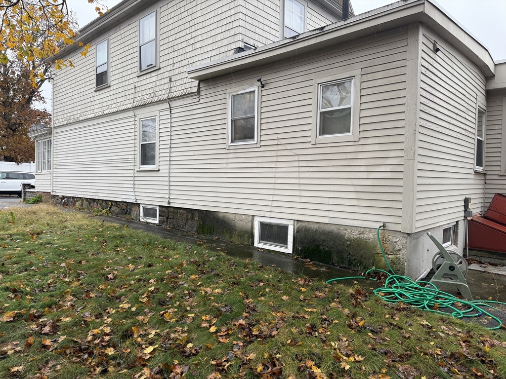 102 Weare Street Lawrence, MA 01843 - Photo 4 of 27 a view of a back yard of the house