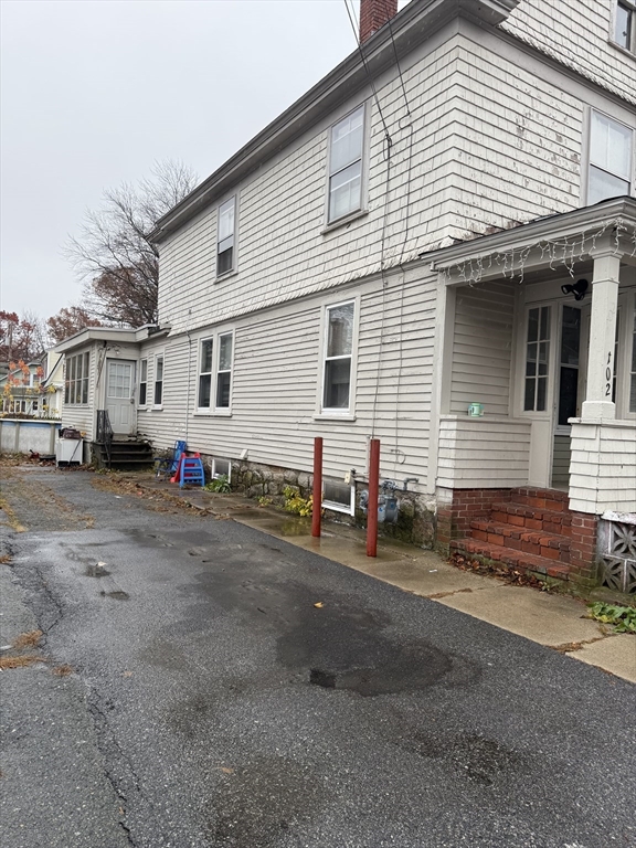 102 Weare Street Lawrence, MA 01843 - Photo 5 of 27 a view of a house with a yard