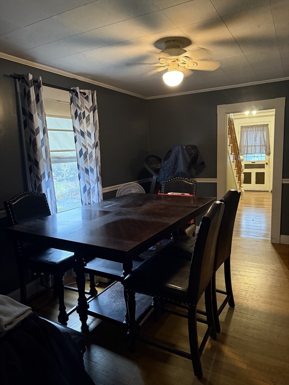102 Weare Street Lawrence, MA 01843 - Photo 7 of 27 a view of a dining room with furniture and wooden floor