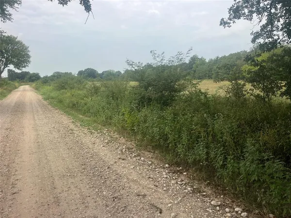 a view of a lake with houses in the back