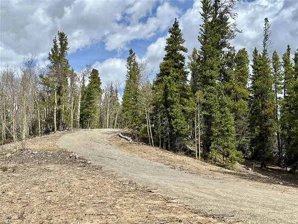 a view of a backyard of the house