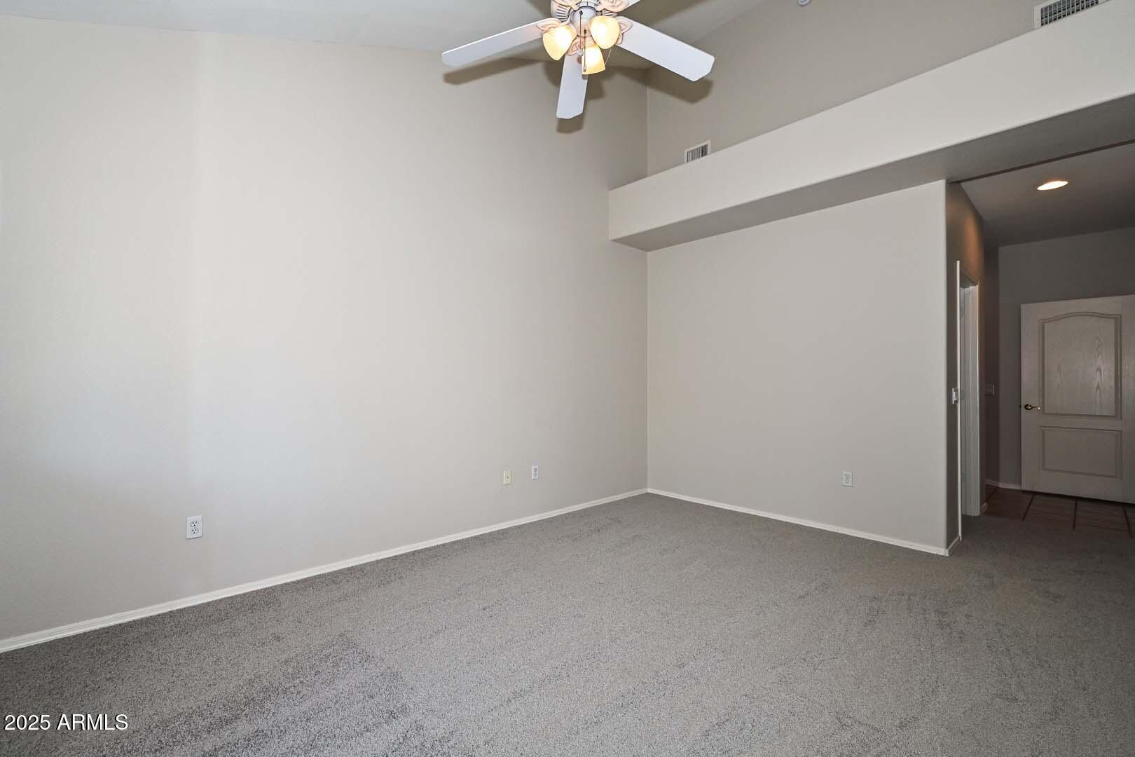 7101 West Beardsley Road, Unit 1104 Glendale, AZ 85308 - Photo 13 of 40 a view of a small space with a chandelier fan