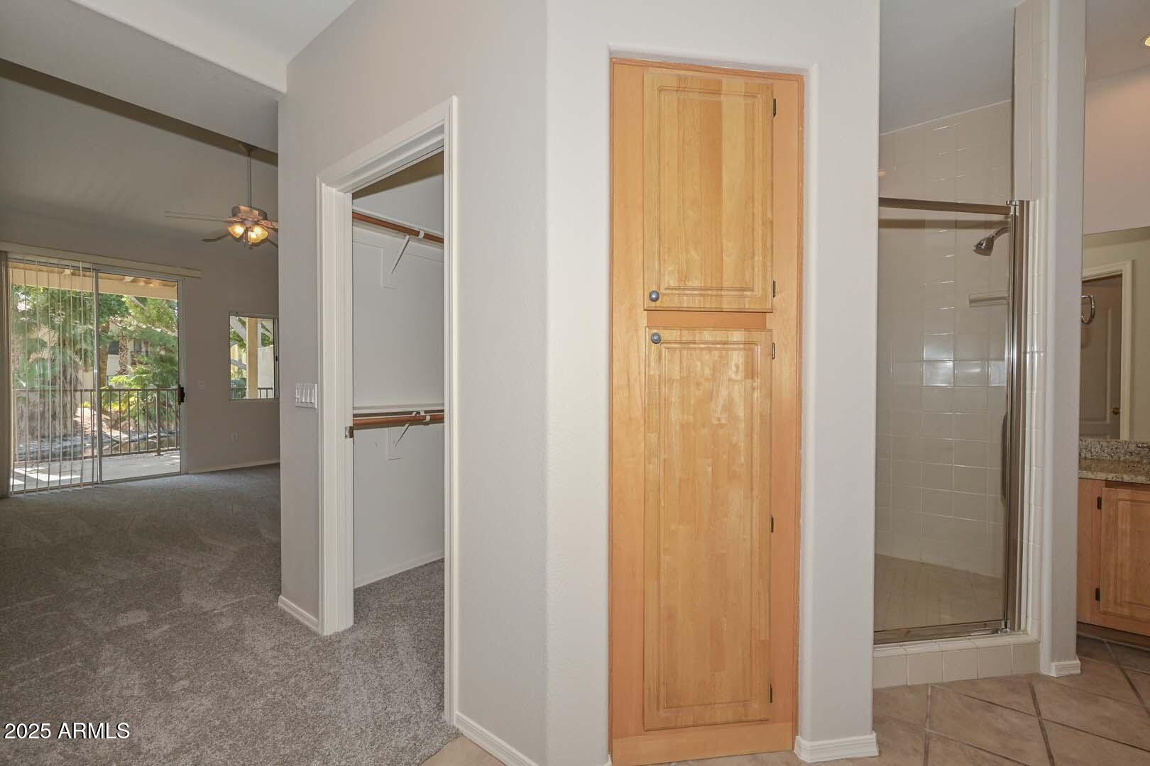 7101 West Beardsley Road, Unit 1104 Glendale, AZ 85308 - Photo 17 of 40 a view of a bathroom with sliding glass door and shower