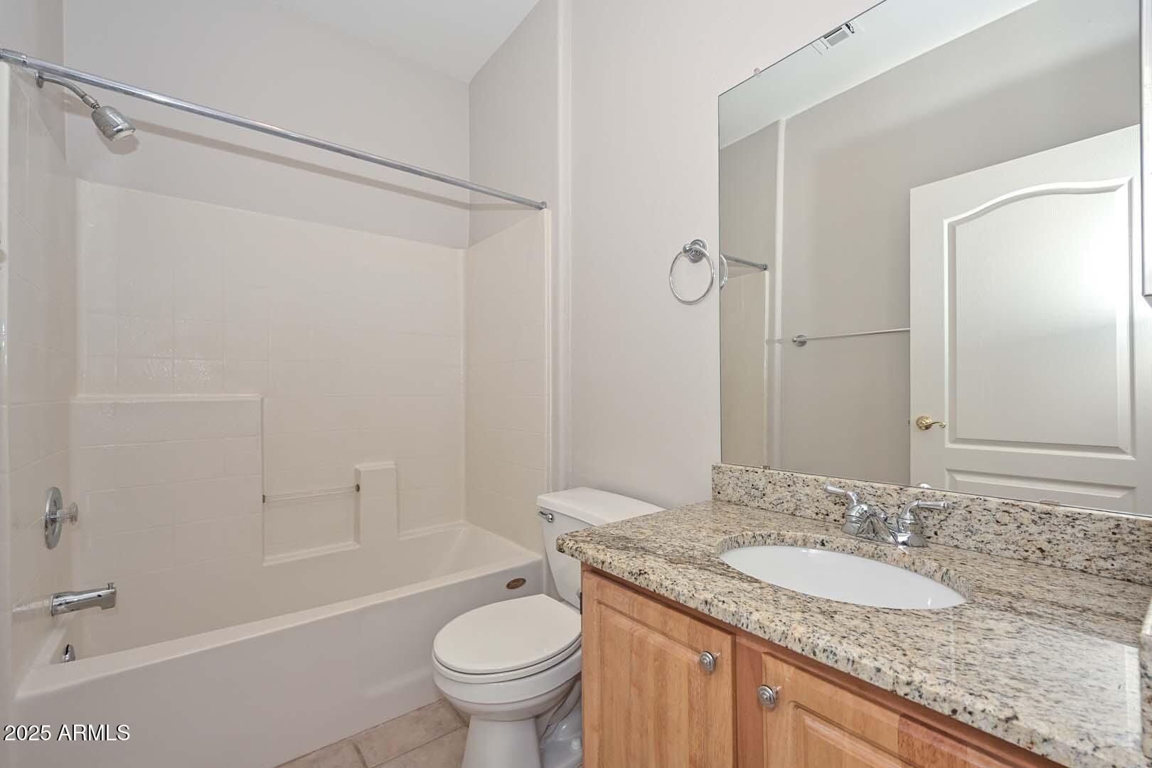 7101 West Beardsley Road, Unit 1104 Glendale, AZ 85308 - Photo 23 of 40 a bathroom with a granite countertop sink toilet and shower