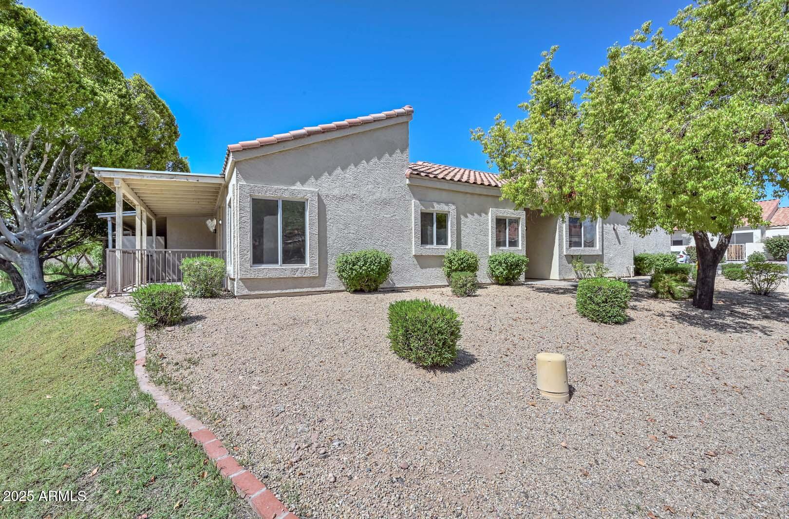 7101 West Beardsley Road, Unit 1104 Glendale, AZ 85308 - Photo 26 of 40 a view of a house with a yard