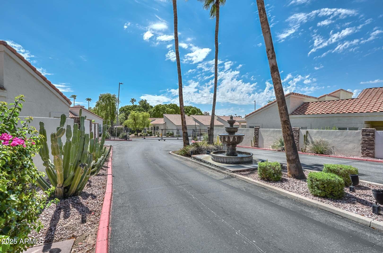 7101 West Beardsley Road, Unit 1104 Glendale, AZ 85308 - Photo 37 of 40 a view of a street with potted plants