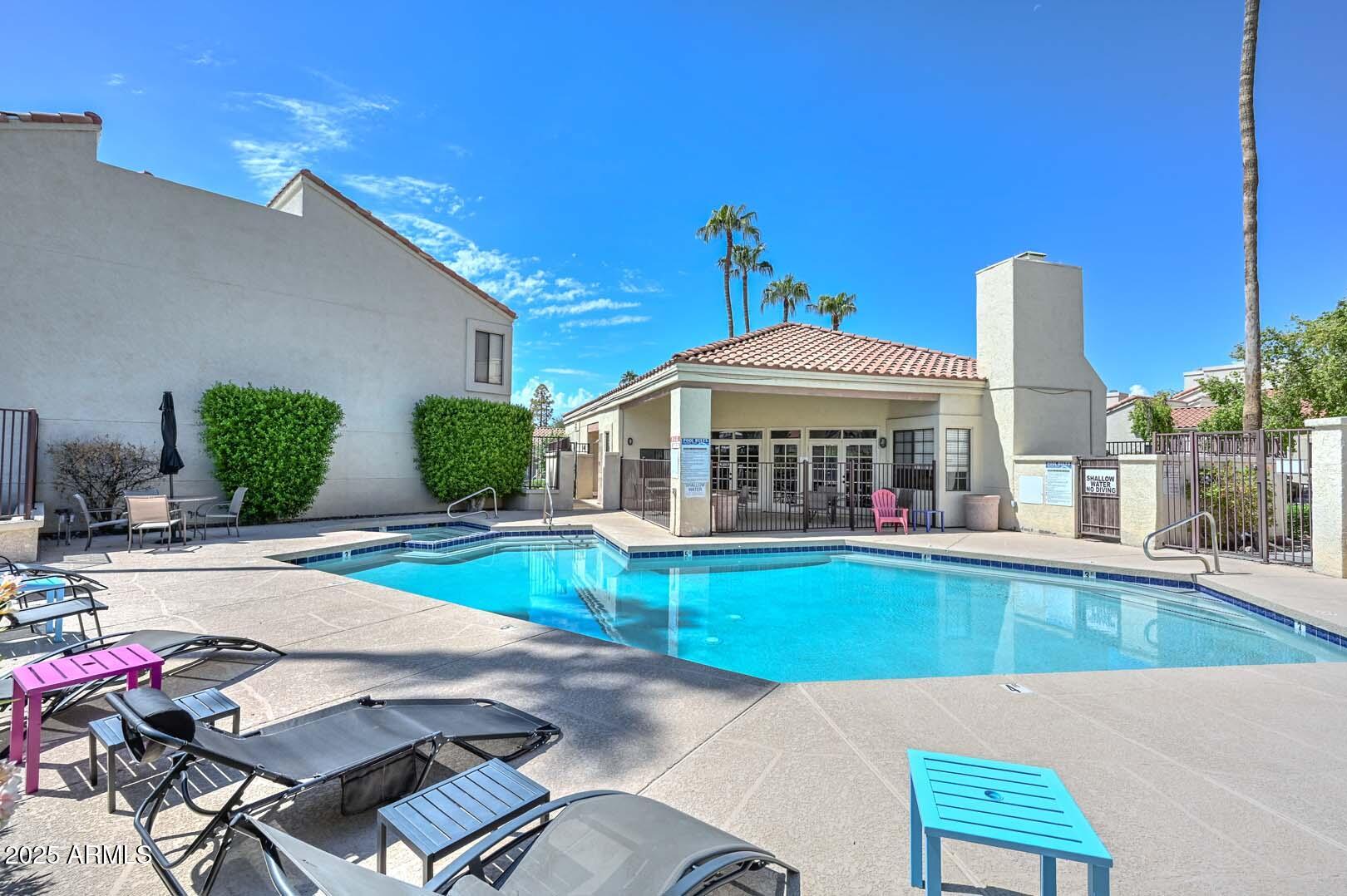 7101 West Beardsley Road, Unit 1104 Glendale, AZ 85308 - Photo 40 of 40 a view of a house with swimming pool and sitting area