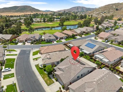 an aerial view of a house with a garden