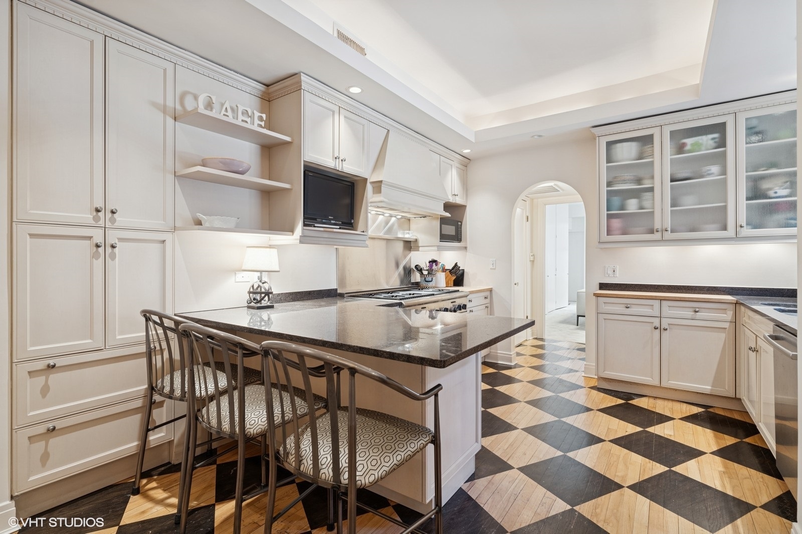 232 East Walton Place, Unit 4E Chicago, IL 60611 - Photo 14 of 32 a kitchen with stainless steel appliances a stove a sink and a refrigerator